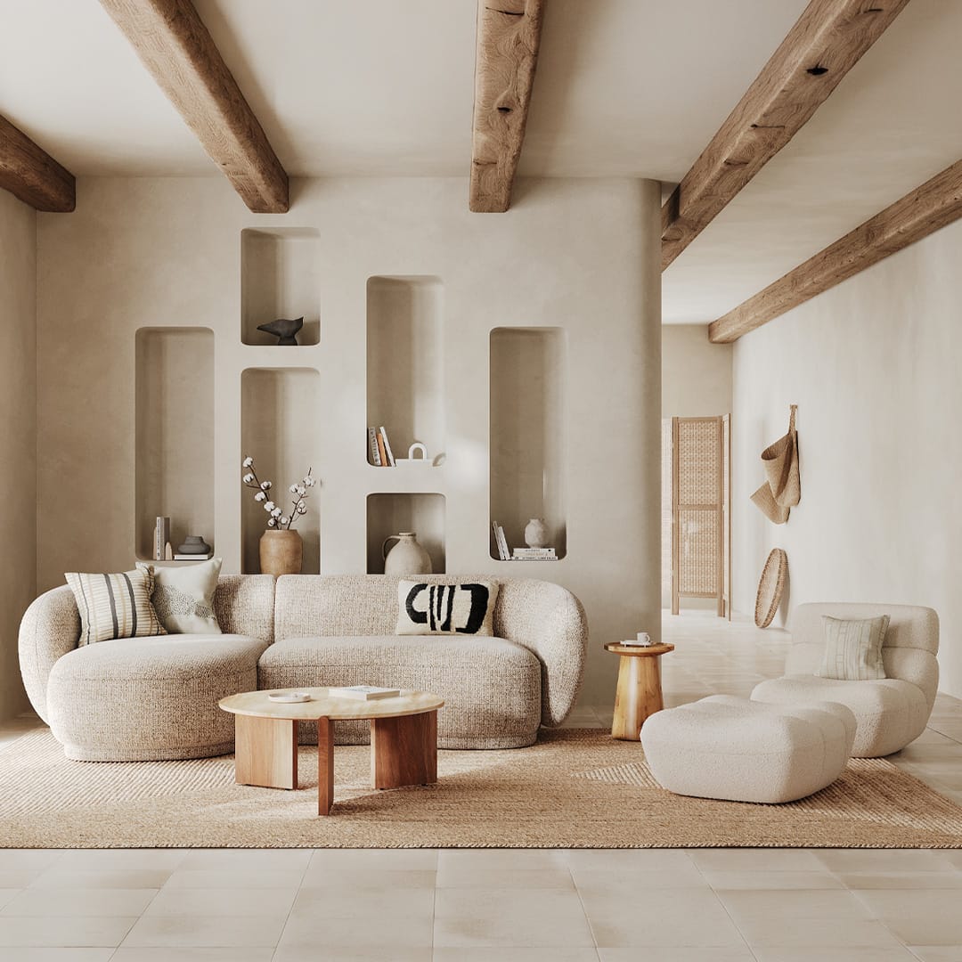 Salon wabi-sabi avec canapé arrondi en bouclé beige, table basse bois et poutres apparentes – Maison Pavane
