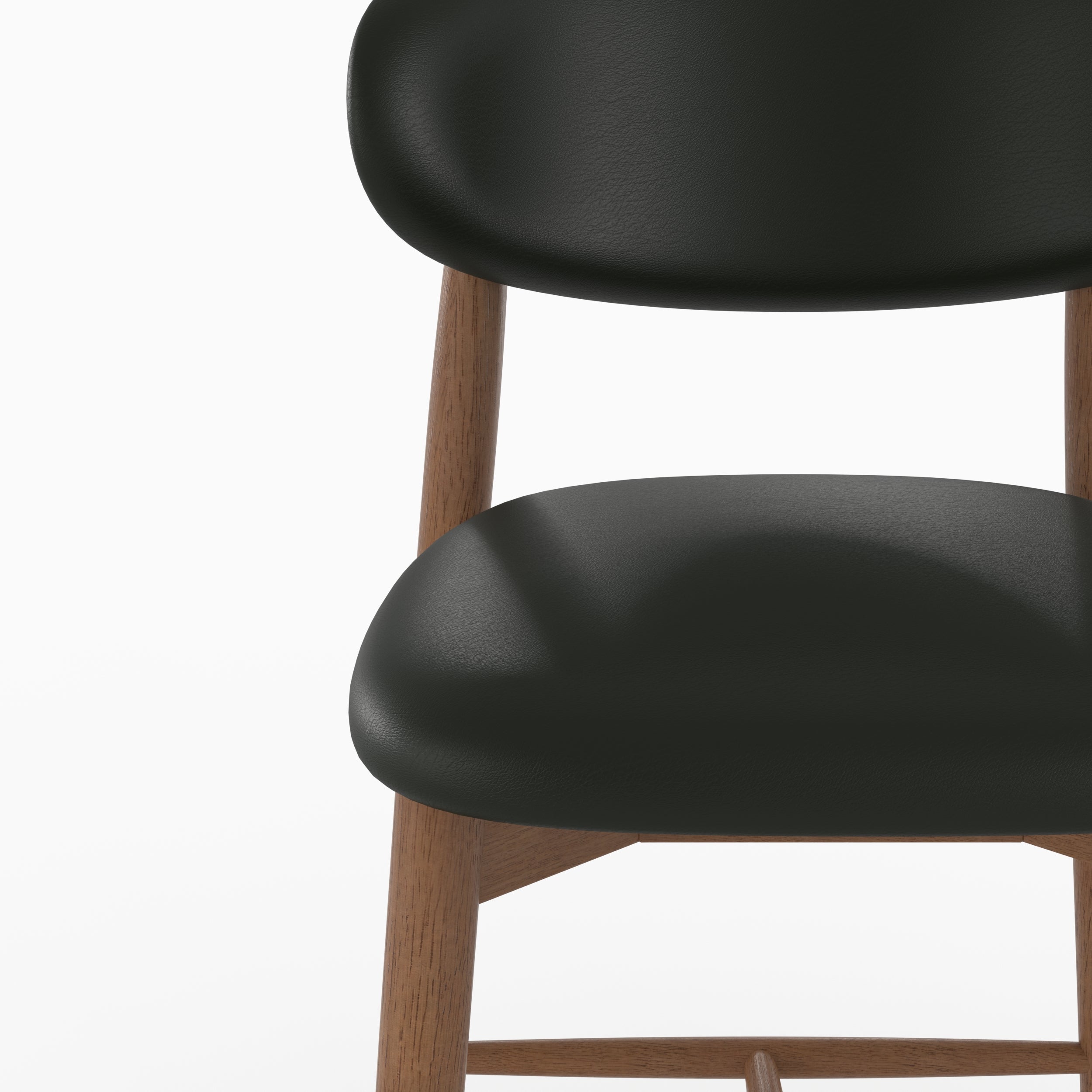 Chaise pour ilot central Yuna en cuir synthétique noir, zoom sur l'assise et le dossier - Maison Pavane