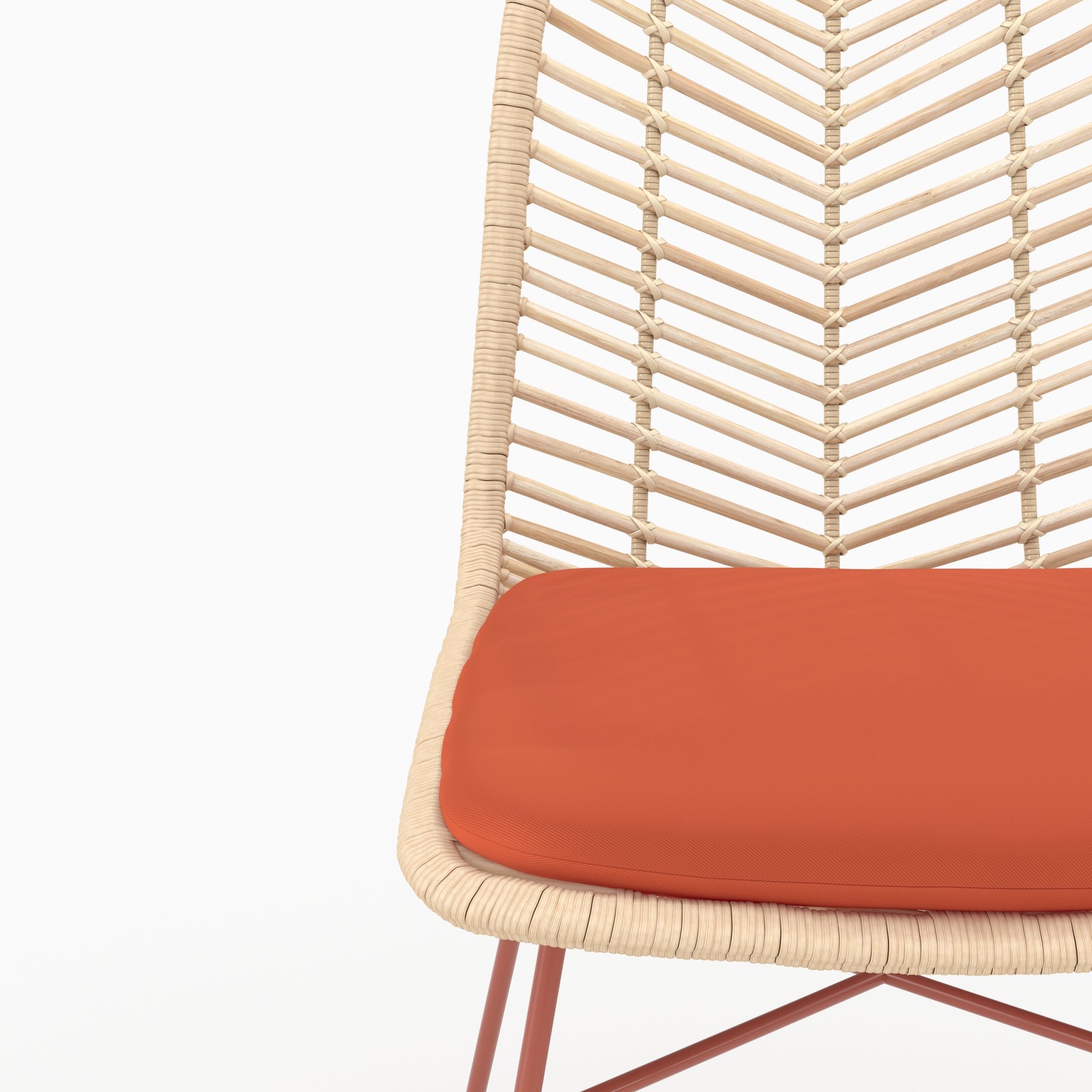 Détail de l'assise en tissu orange vermillon et du dossier en rotin de la chaise Tamara - Maison Pavane