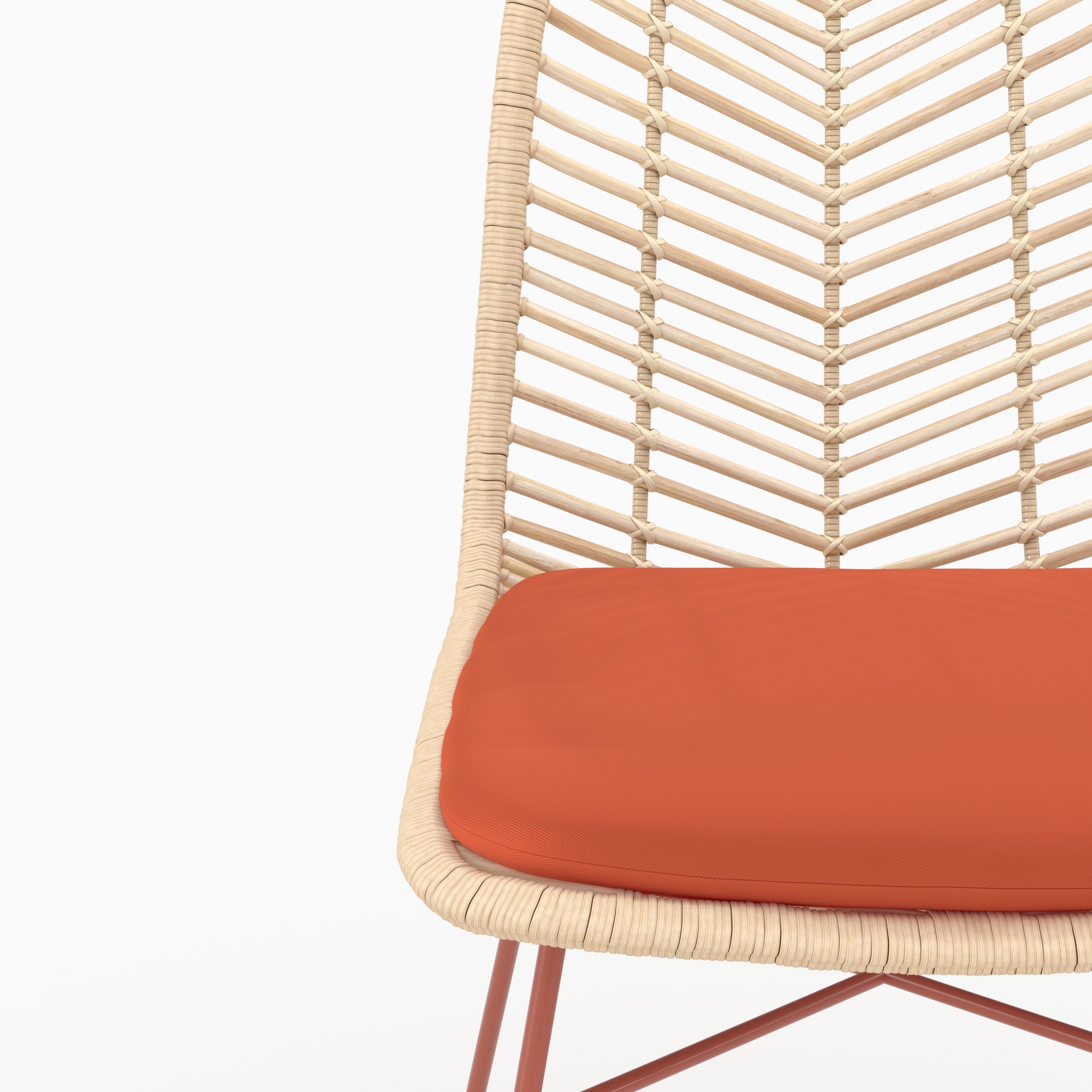 Détail de l'assise en tissu orange vermillon et du dossier en rotin de la chaise Tamara - Maison Pavane