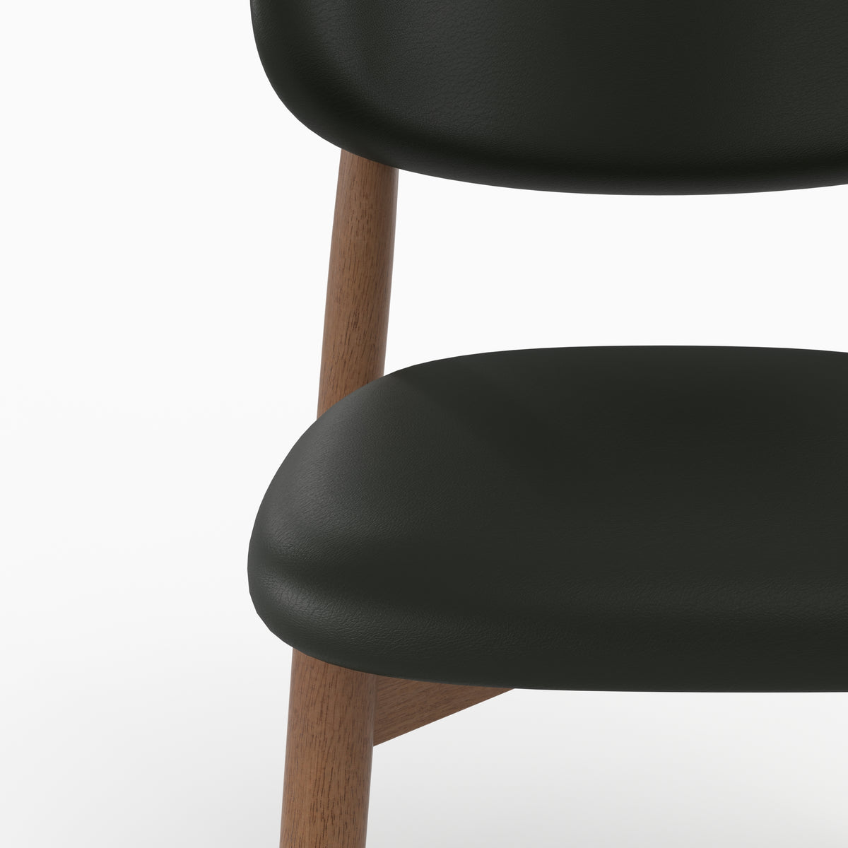 Chaise Yuna en cuir synthétique noir, zoom sur l'assise et le dossier - Maison Pavane