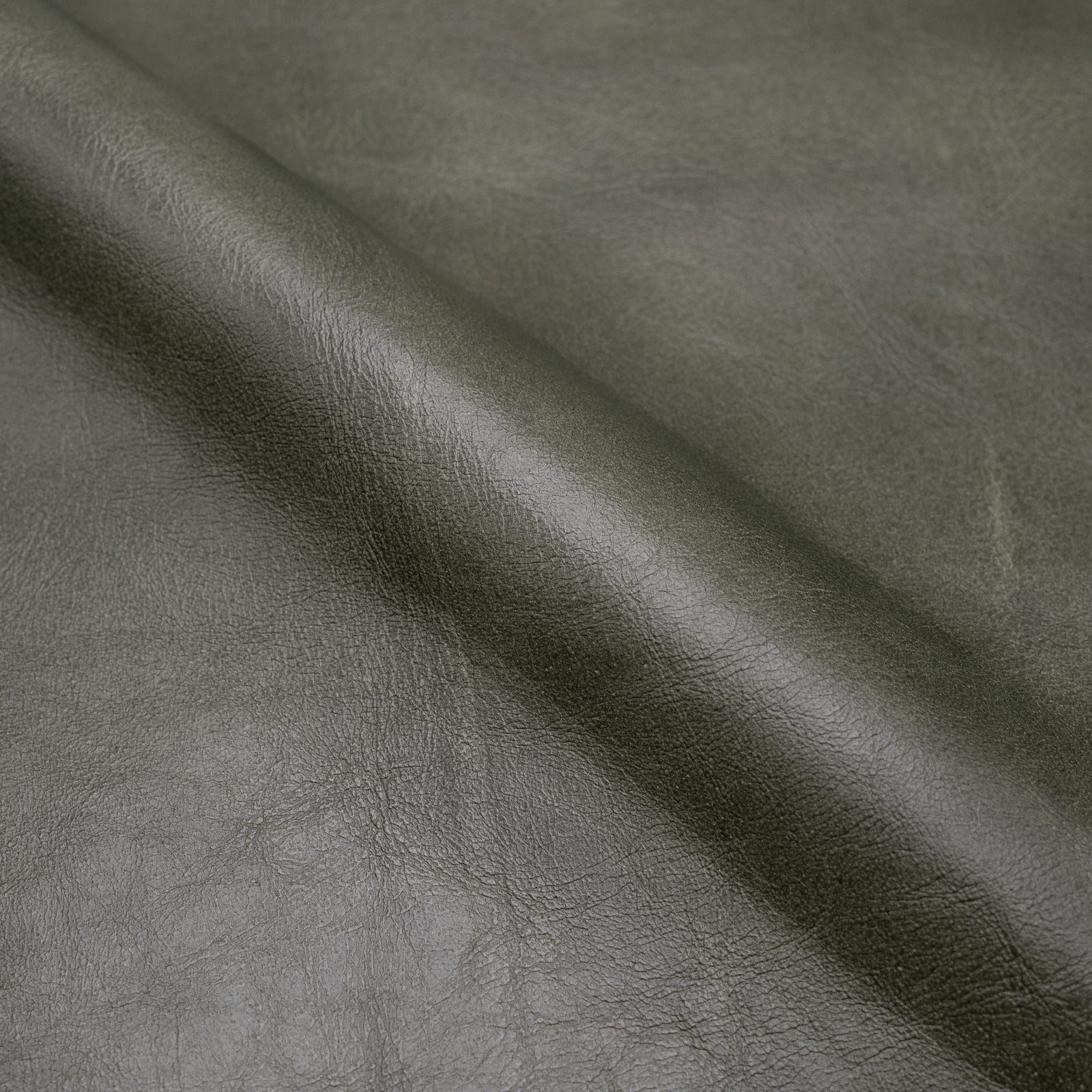Fauteuil en cuir vert papillon Octave