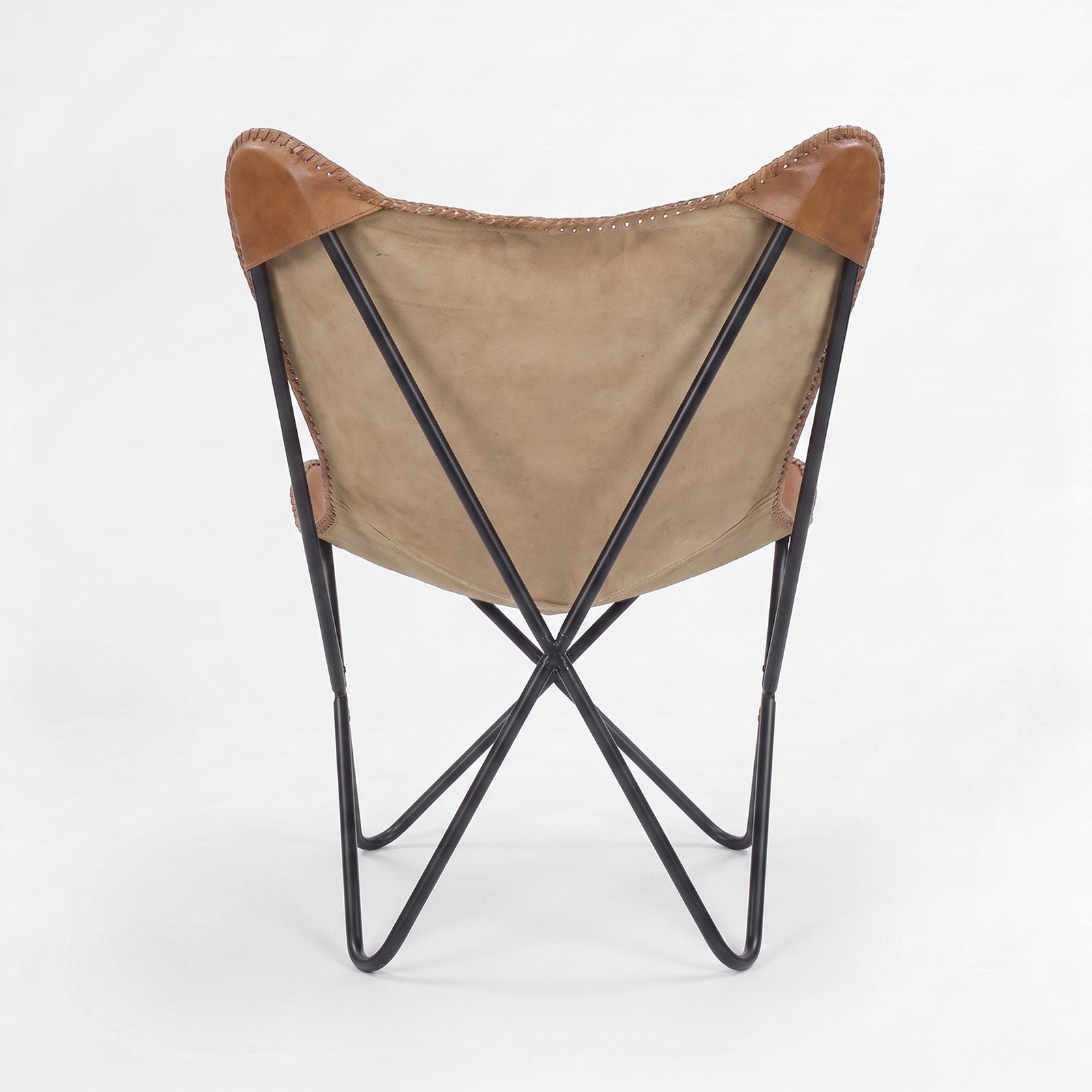 Fauteuil papillon Octave en cuir de buffle marron, vue de dos - Maison Pavane