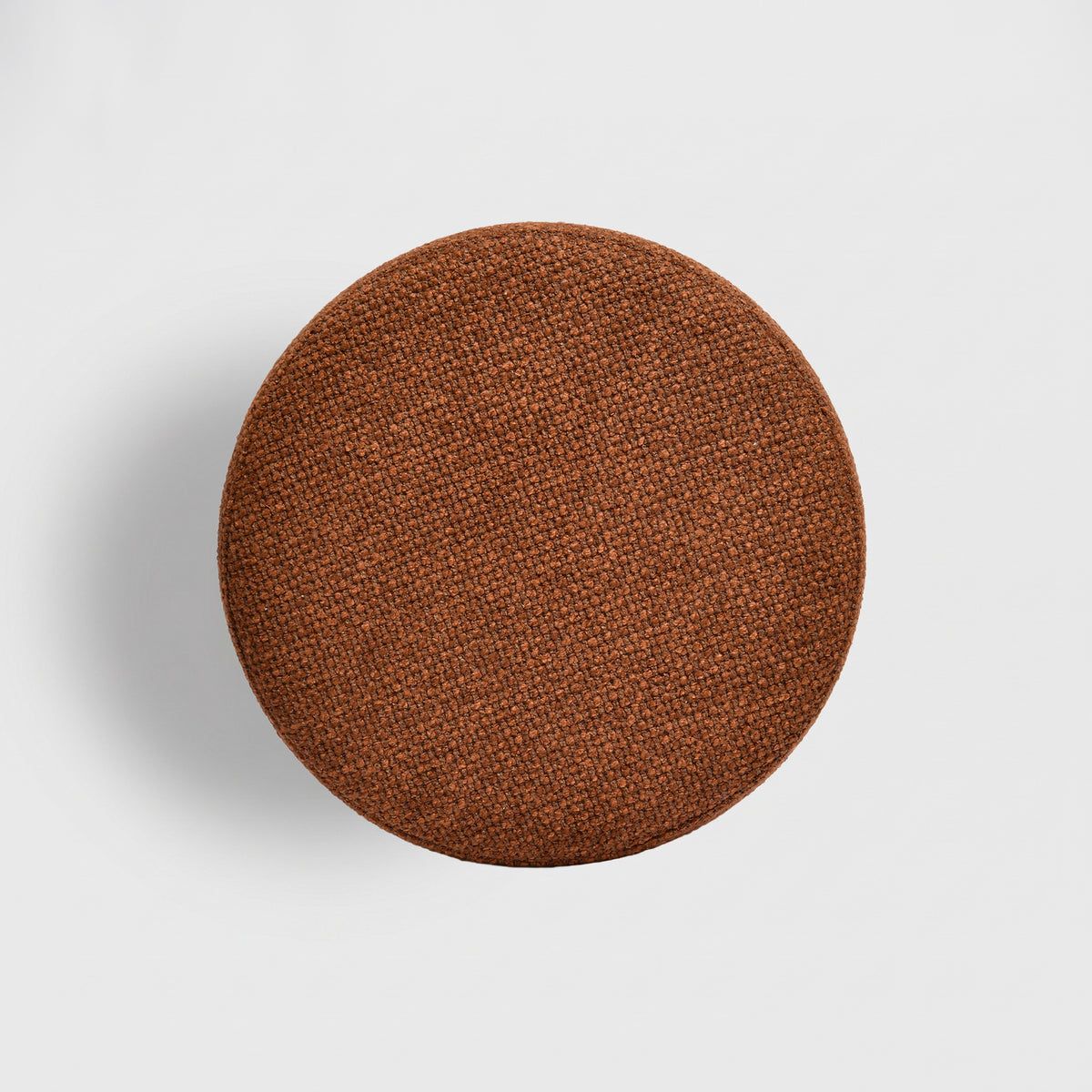 Pouf Lily rond en tissu texturé terracotta, vue de dessus - Maison Pavane