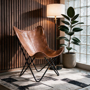 Fauteuil papillon Octave en cuir de buffle marron