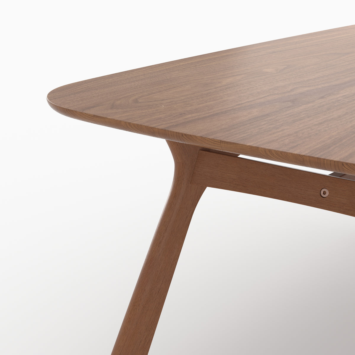 Détail du plateau et du piétement de la table rectangulaire Paula en chêne foncé - Maison Pavane
