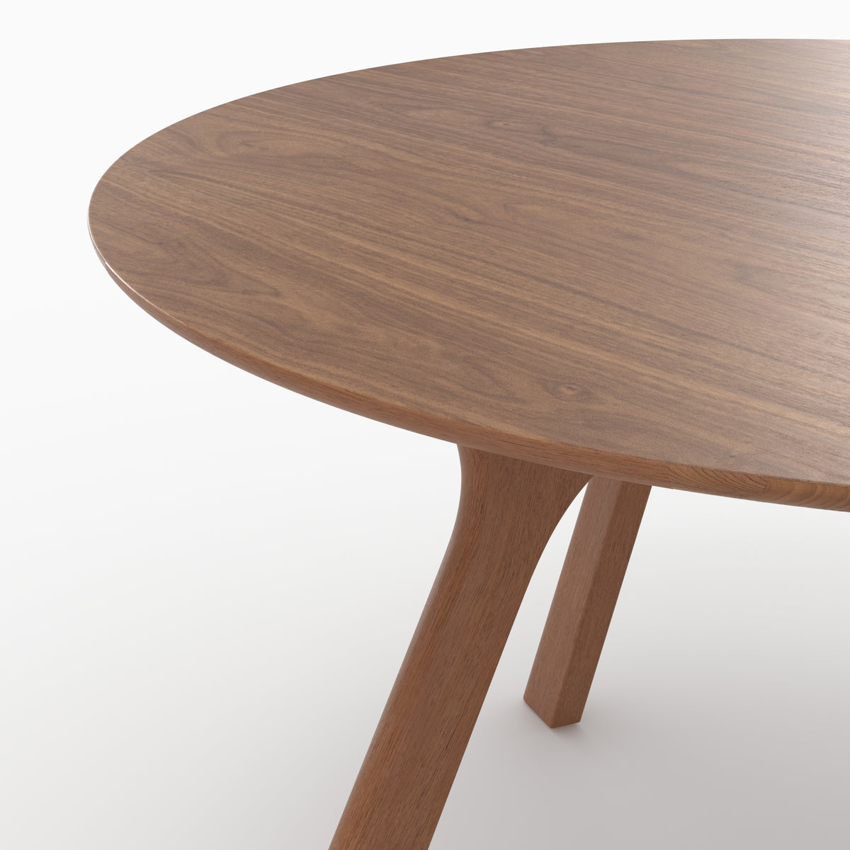 Détail du plateau et du piétement de la table ronde Izzi en chêne foncé - Maison Pavane